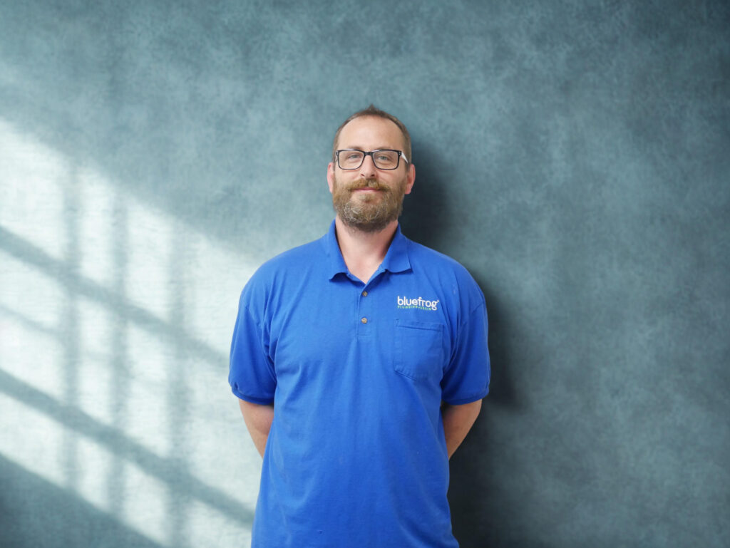 Plumbing technician in blue polo